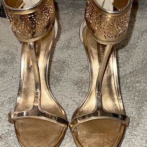 BCBGMaxazria gold t-strap heels